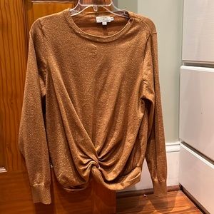 Sparkle at your holiday celebrations! La Madison Molly Bracken twist-hem top.